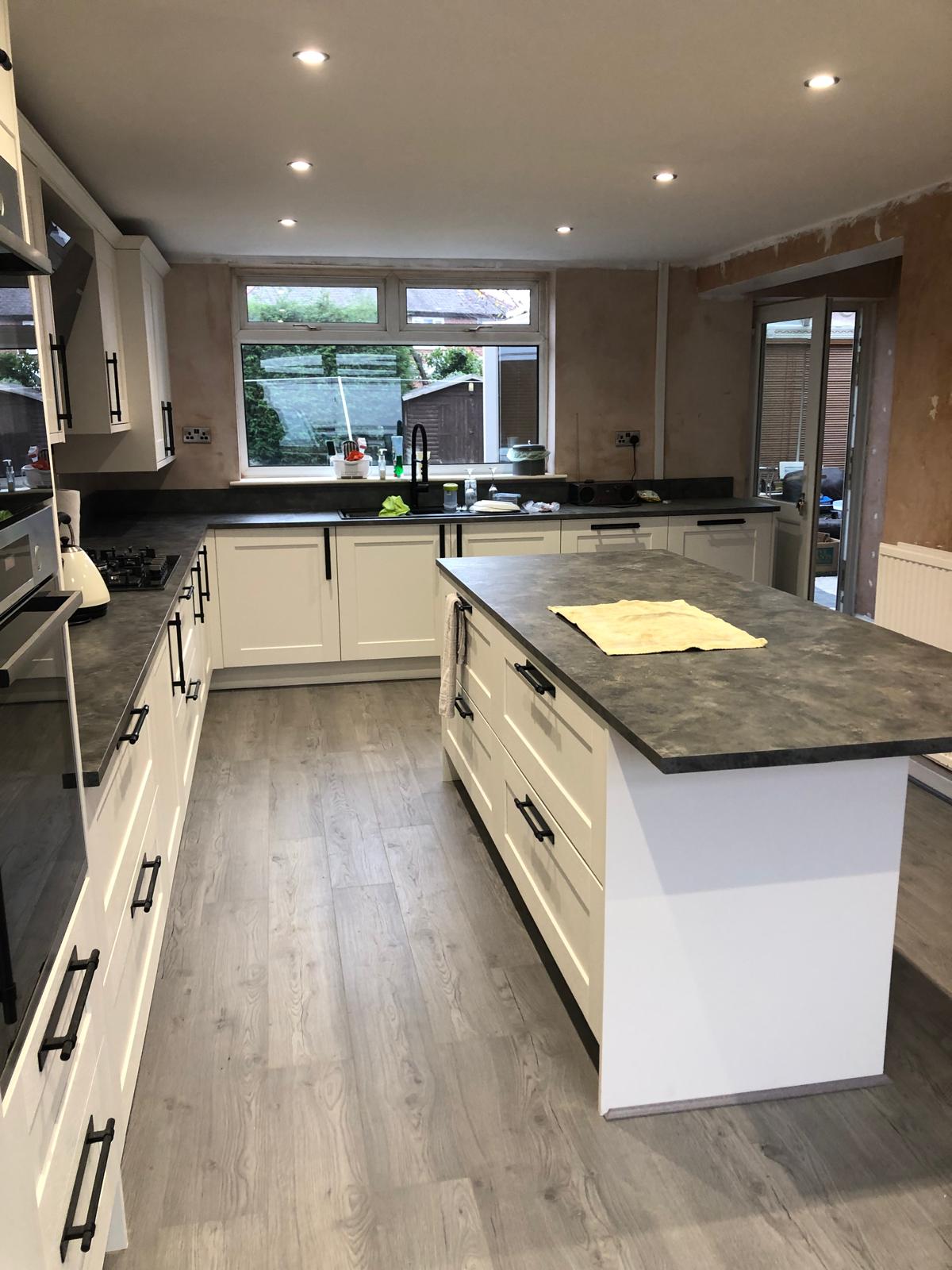 Kitchen renovation consultation with professional fitter